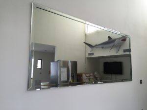 mirror with beveled strips applied at perimeter