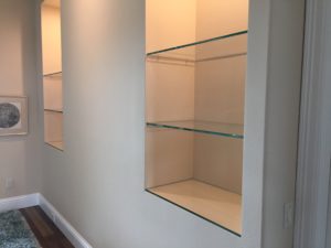 glass shelves installed in niches